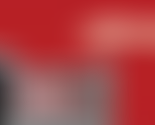 Hand hovering over an open file drawer filled with folders against a solid red background.