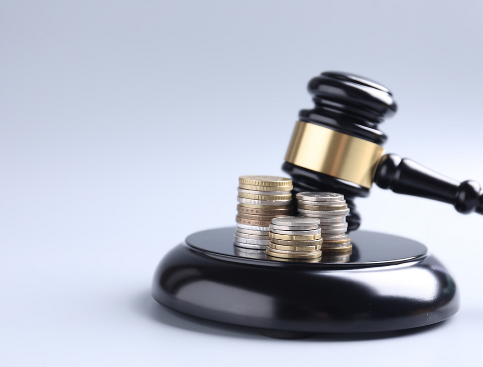 Judge’s gavel beside stacks of coins on a black base, symbolizing financial law or a court ruling over money.