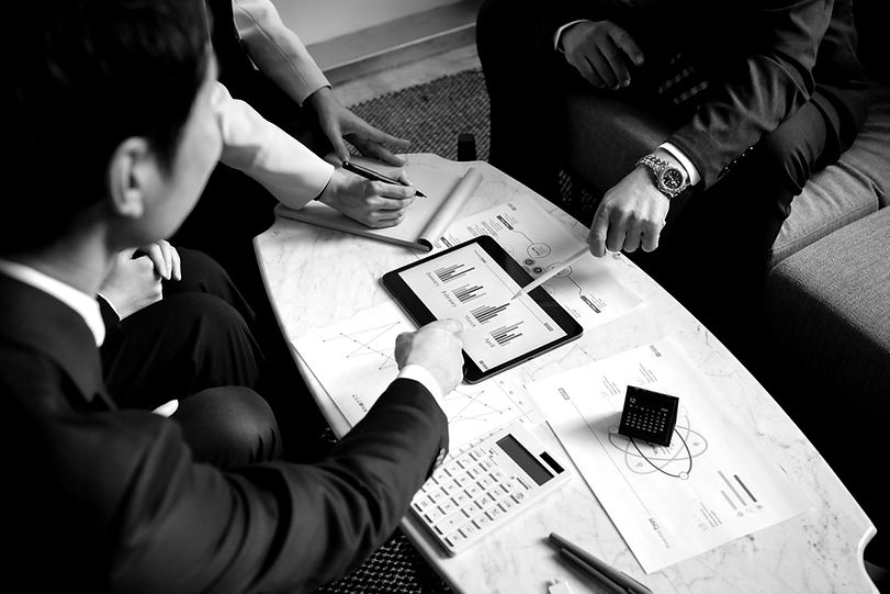 business-people-working-with-ipad-high-angle (1)_edited.jpg