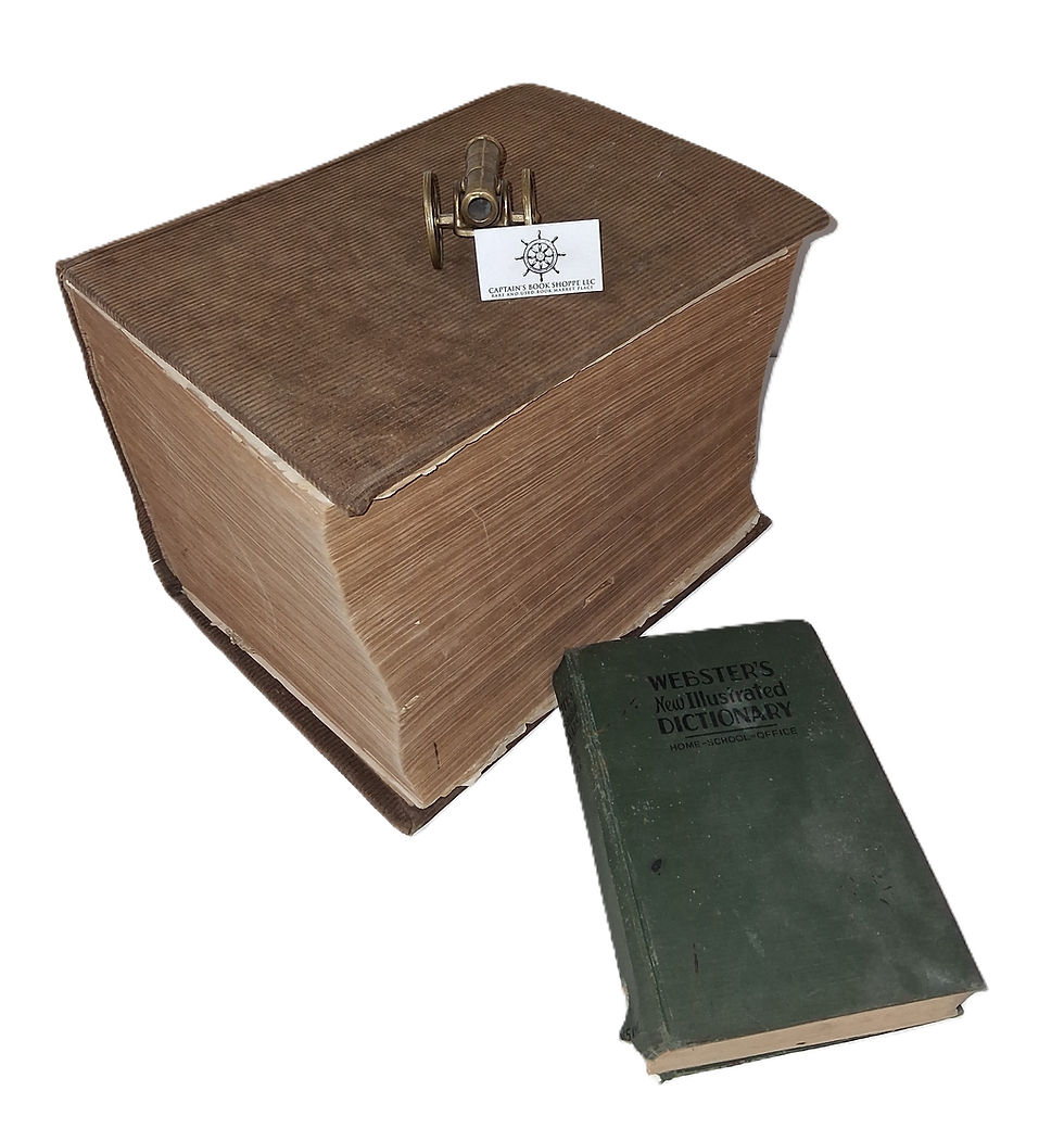 Two books: one very large with a mini cannon model and business card on top. The card states: Captain's Book Shoppe. A smaller green Webster's New Illustrated Dictionary.