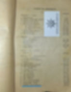 Table of contents on aged paper lists chapters on drill, weapons, and combat. A business card with a ship wheel logo overlays the page.