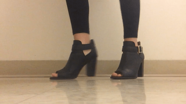These opened toes heeled booties are great for spring. They're black with a gold buckle.