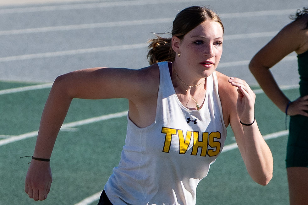 Two kids adjusting hats during Sandlot baseball game