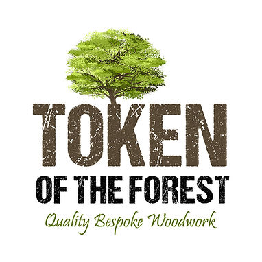 Logo of Token of the forest featuring a large green tree with the text quality bespoke woodwork below
