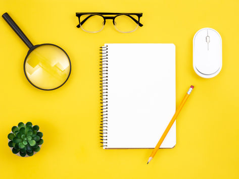 A notebook, magnifying glass, pencil and more on yellow  surface (credit PVProductions on freepik)