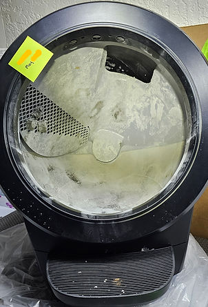 Dirty Litter-Robot 4 automatic litter box caked with waste buildup before deep cleaning by Litter Mates.