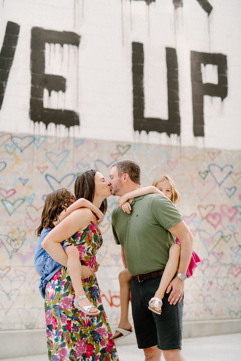     Parents holding their children during a natural lifestyle fall family photography session