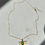 Thumbnail: 24k gold plated chain necklace with brass flower & green gem charm pendants on pink background
