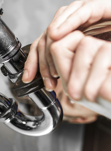Plumber fixing pipe in Shepperton Surrey emergency plumbing service