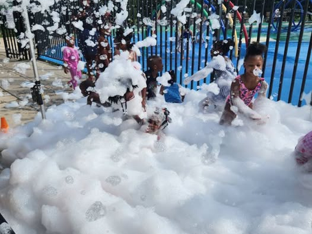 Children Playing in Foam at the Carl Sharif Playground in Weequahiic Park.