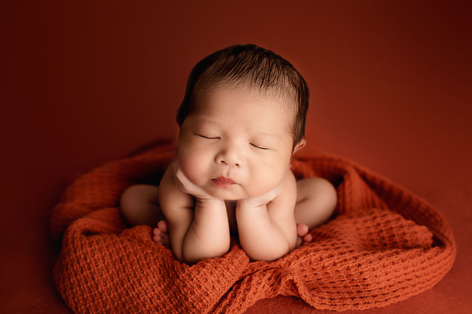 Newborn baby boy in a Froggy Pose