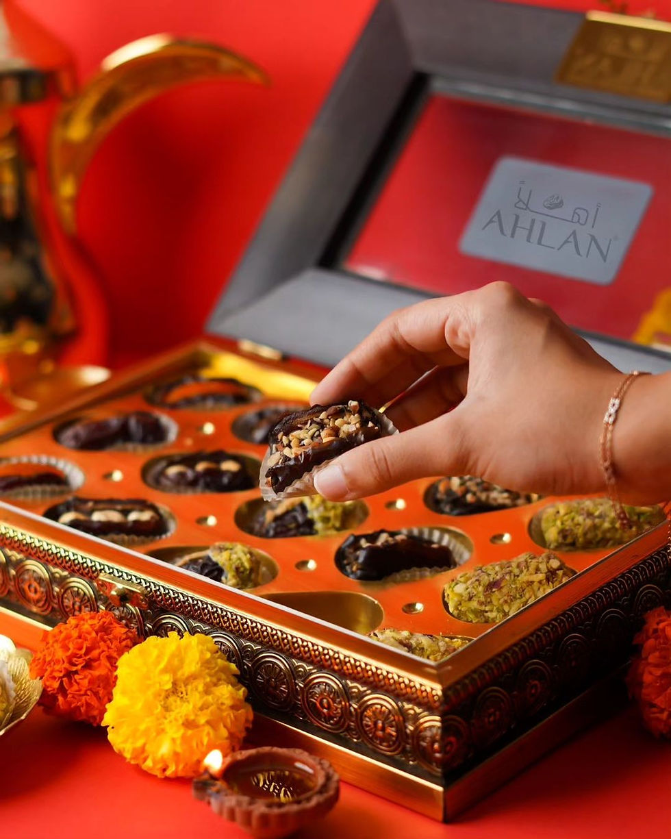 Ahlan Dates curates an exceptional range of luxurious Middle Eastern confections, thoughtfully crafted for the Indian market. Seamlessly blending heritage with innovation, they deliver a refined indulgence that caters to everyday moments and premium gifting alike. Ahlan Dates pride themselves on offering the finest selection of dates, meticulously sourced and expertly crafted to elevate your culinary experience. With a focus on health, sustainability, and authenticity, they redefine the art of savoring nature’s finest flavors. 