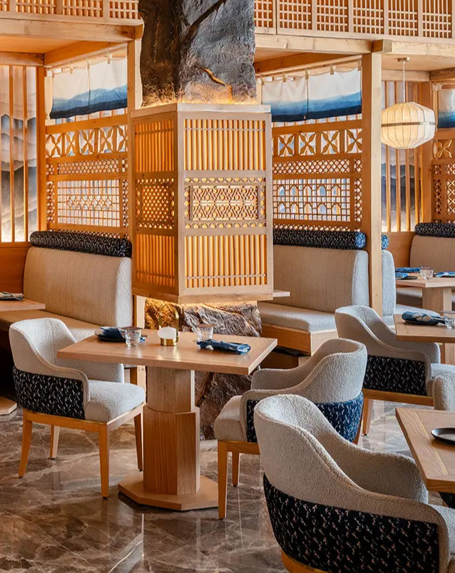 Ryu Oka is a restaurant which serves fine dining experience with the touch of mountain-inspired art and stone walls cut out straight from the huge mountains of Himalayas. The wooden interior takes us back to the nature and its inspiration. The ambience provides sensory experience with Asian food blending it with the traditional lifestyle of Ladakh. The large windows frame sweeping views of the valley, keeping the natural beauty of the place intact while giving you company.