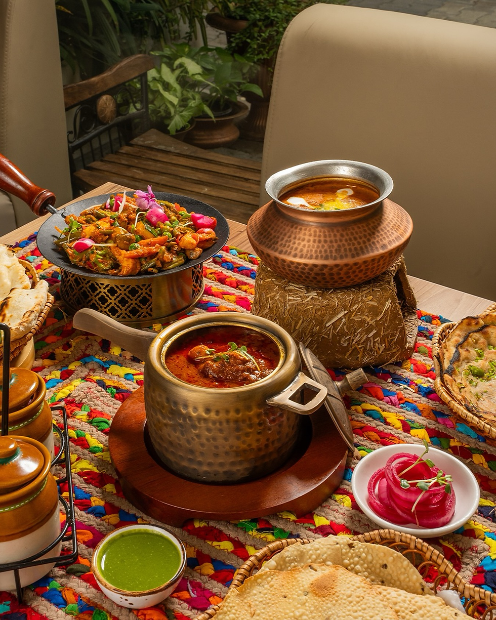 The food is curated with love and care of Masterchef Mahabir Singh who has chased the perfect bite with his magic masala a closely guarded blend of thirty five spices and and chef Sumant who started his culinary journey at Gurudwara Langar. The restaurant serves traditional North Indian cuisine infused with contemporary dishes. The restaurant offers fine dining experience with its five pillar that is the guide to its scrumptious dishes namely magic masala, patience pot, memory of taste, copper legacy and finest version. The food ranges from Awadhi Chicken Biryani, Ranjhe Di Kukad Curry, Cheesy mushroom bomb, Spinach Fritter chaat and many dishes exclusively crafted for Kids.