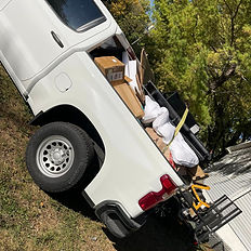 Debris removal loaded in a truck to take to the landfill. Trash removal.