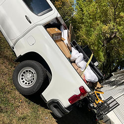 Debris removal loaded in a truck to take to the landfill. Trash removal.