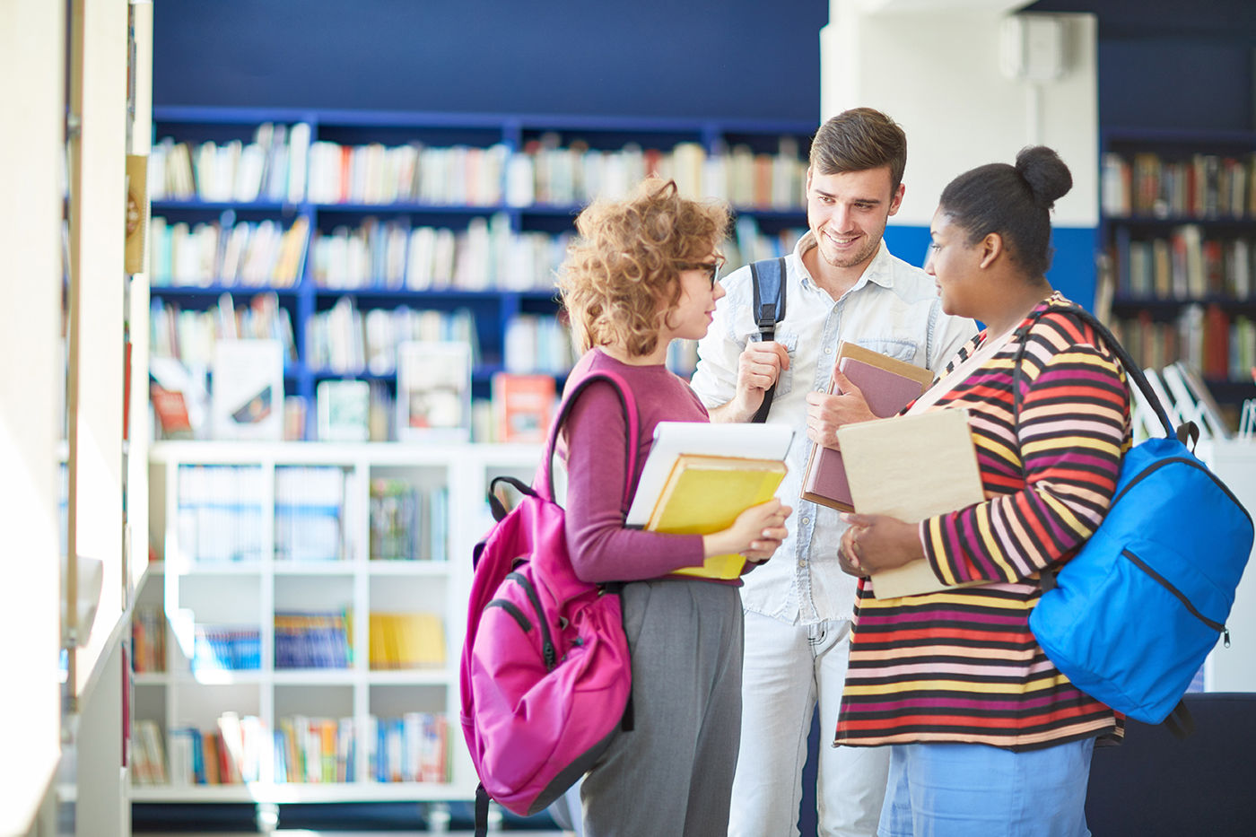 The same Envato image featuring the same group of people in the same bookstore at the end of the "Being John Malkovich" project.