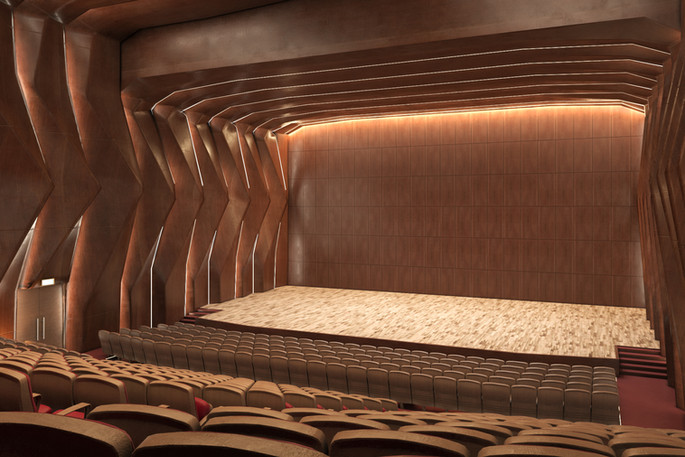 Rear interior of a recital hall with pale stage and ribbed timber shell.