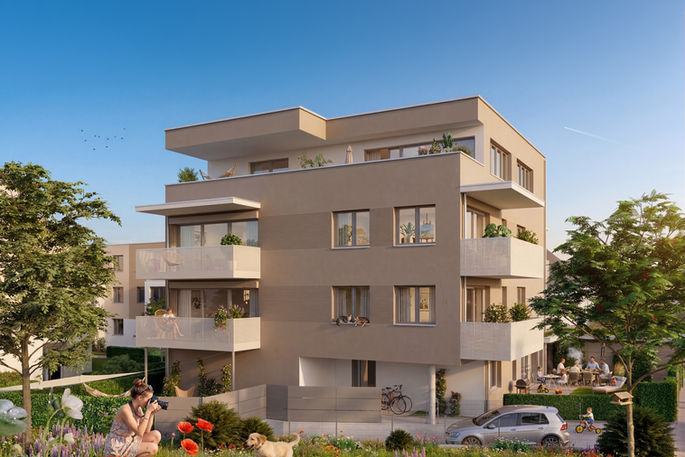 Daylight exterior of a WBG residential building with balconies, planting, and a soft garden foreground.