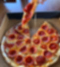 Peperoni coming out of box cheesey 03_edited.jpg