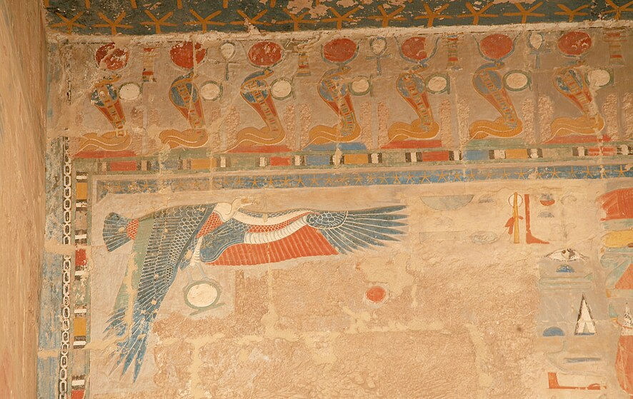 Frieze of uraei bearing sun disks at the top of a wall in the Temple of Hatshepsut