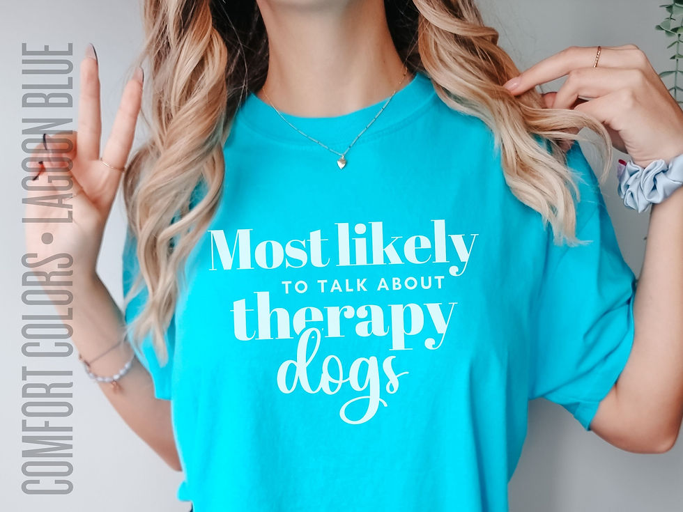 Thumbnail: Photo of woman's Lagoon Blue Comfort Colors t-shirt with the saying "Most Likely to Talk About Therapy Dogs"