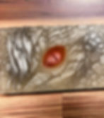 Soap bar with a shimmering dragon eye design and scaly texture.