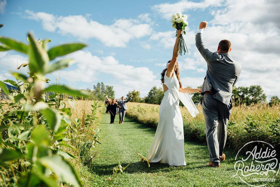 wedding couple celebrate near field aisle toad hill farm addie roberge photo.jpeg