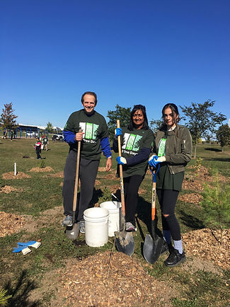 Michael Bastian and his family planting trees with TD in Ward 6, Mississauga