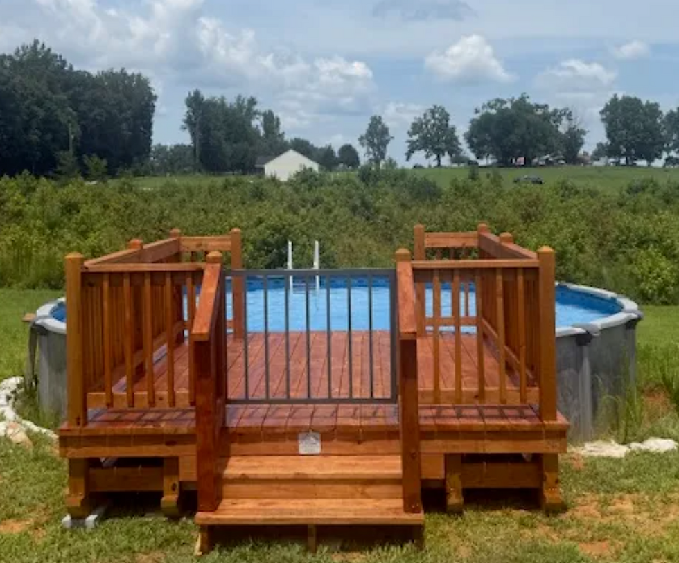 Portable deck installed next to an above-ground pool.