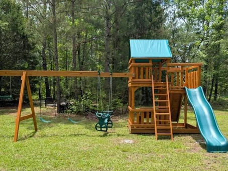 SSY2 wooden playset with swings, slide, rock wall, and canopy sold to a family in Odum, Georgia.