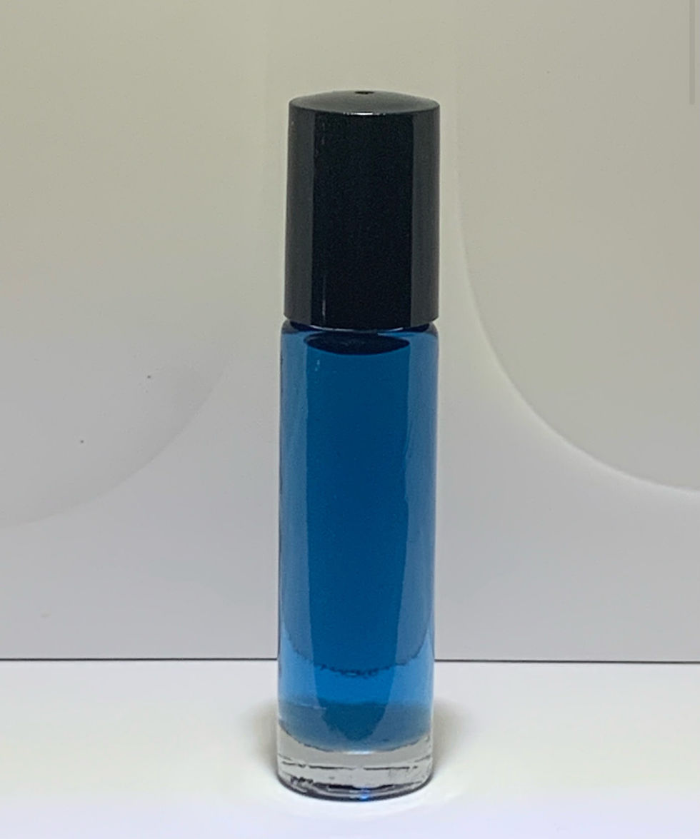 Blue perfume oil called "love spell" in a glass bottle