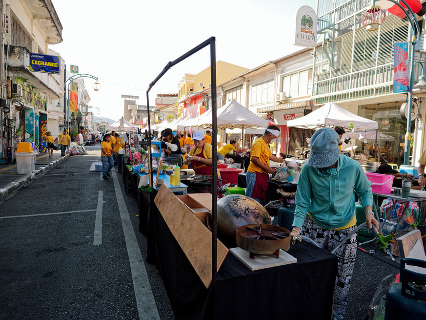 People getting ready cooking for the market in Phuket Old Town in Thailand.