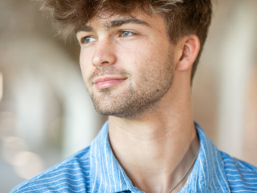 Boy taking senior portraits in an old fort.