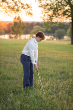 High school senior guy photographed during a senior portrait session with simple, neutral colors
