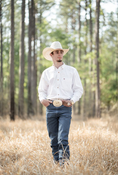 High school senior guy photographed during a senior portrait session with simple, neutral colors