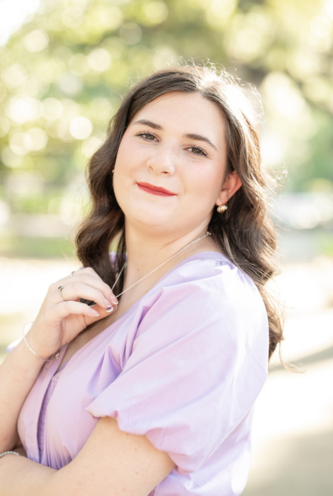 Downtown Mobile senior portraits with colorful flowers and urban backdrops