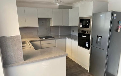 Modern grey kitchen remodel with built in appliances