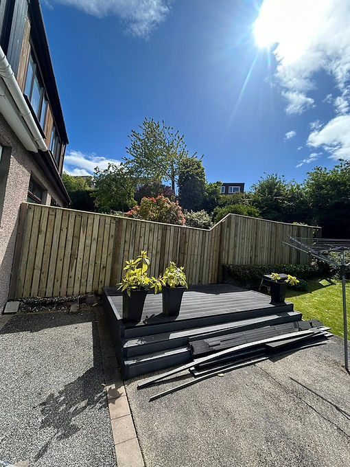 Modern composite decking with new timber fencing