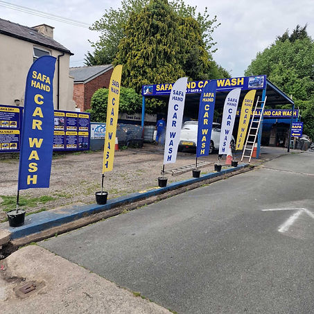 Hand car wash facility with service flags