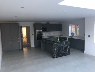 Contemporary open-plan kitchen with marble island