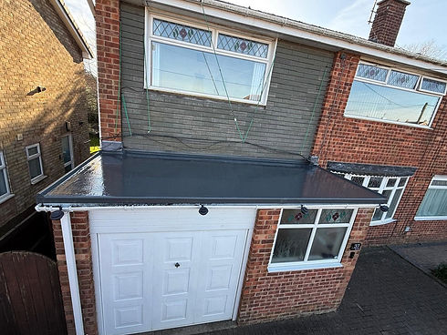 Flat garage roof with durable grey felt covering
