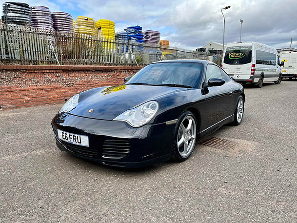Black Porsche car after professional bodywork repair in Dundee