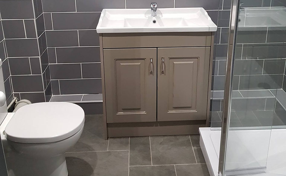 Modern bathroom installation with fitted vanity unit