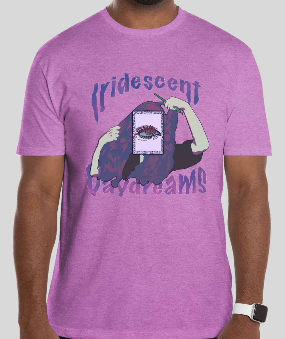 Man wears lavender t-shirt, 'Iridescent Daydreams' eye design.