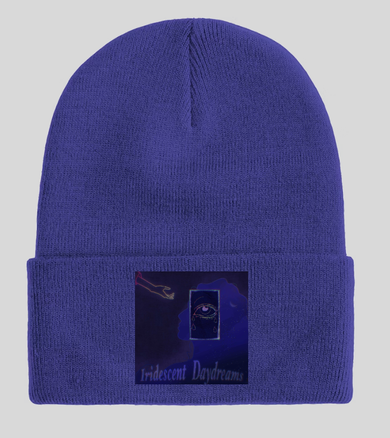 Dark blue beanie with rectangular patch featuring Iridescent Daydreams text.