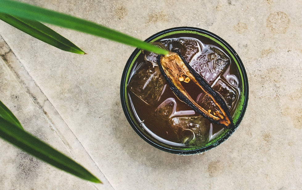 Carriqui's La Picosita Margarita features chile-infused tequila, lime, angostura bitters, and wildflower honey.