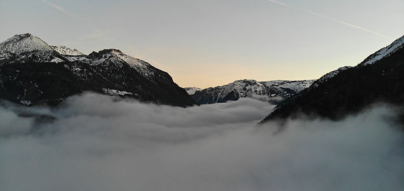 Picture of mountains with low level cloud below them