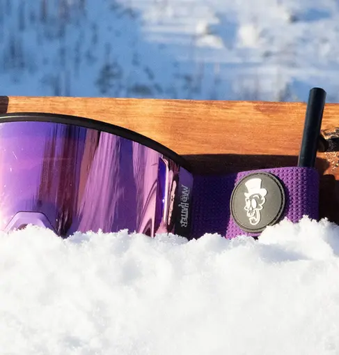Plum Crazy Purple Snow Goggles with magnetic lens in snow