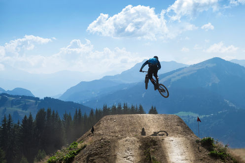 Mountain Bike Rider Wearing a Mad Hatter Ware Mountain Bike Helmet